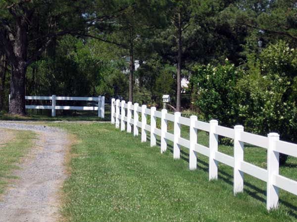 white rail ranch style vinyl fence